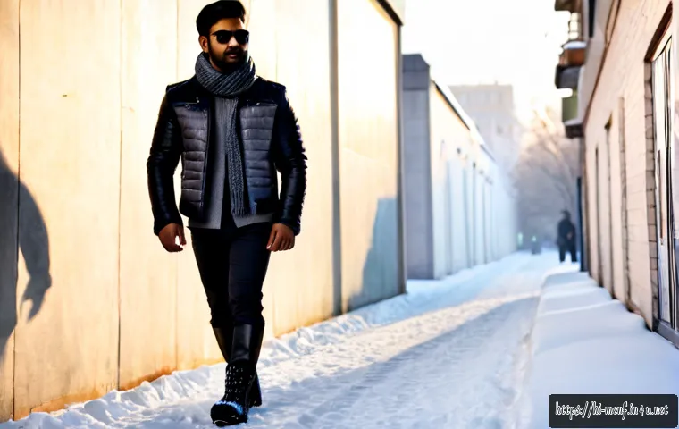 Home 17 남성 겨울 부츠 스타일 - Photorealistic full-body winter street style portrait of a stylish Indian man wearing dark leather l...